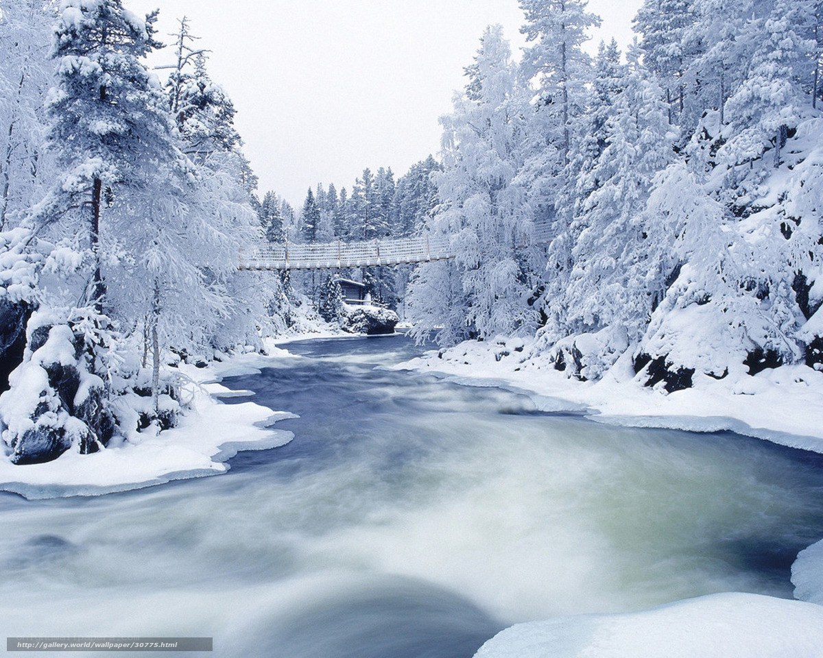 Snowy river with suspension bridge