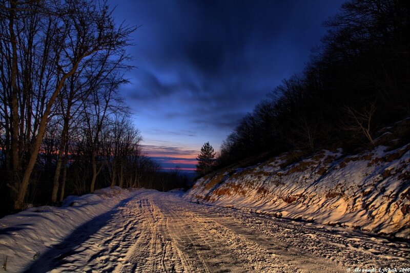 Snowy road at dusk