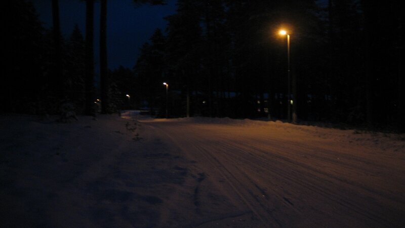 Snowy road at night