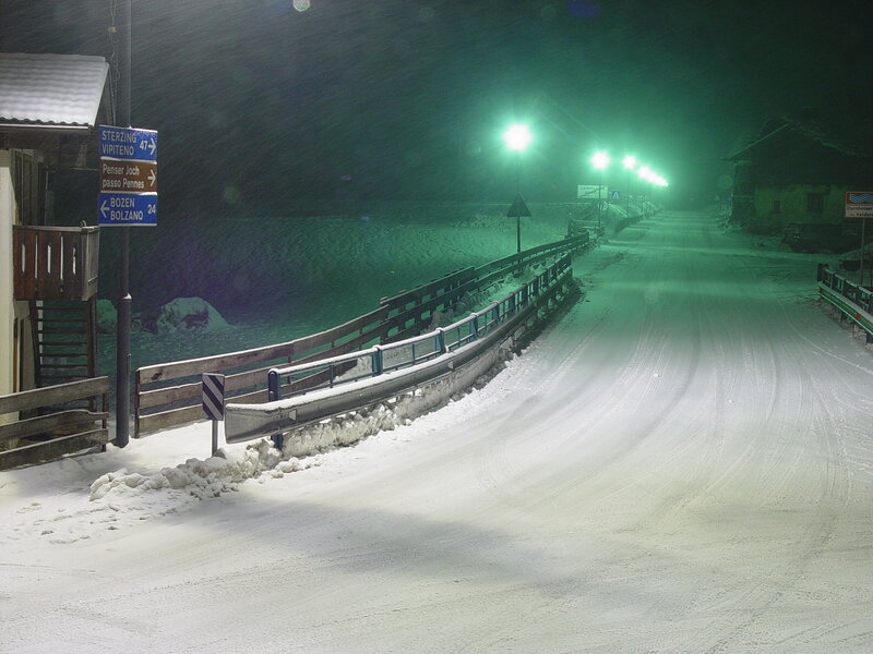 Snowy road at night
