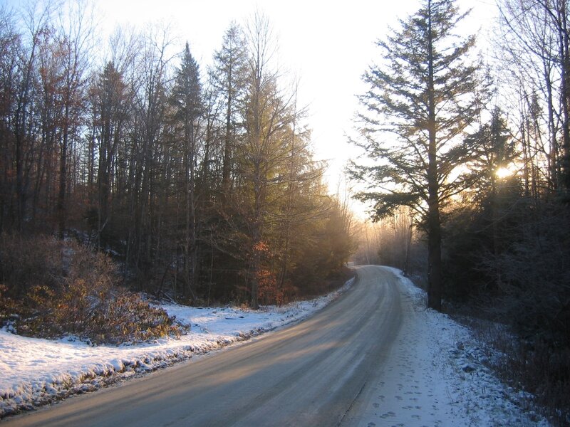 Snowy road at sunrise