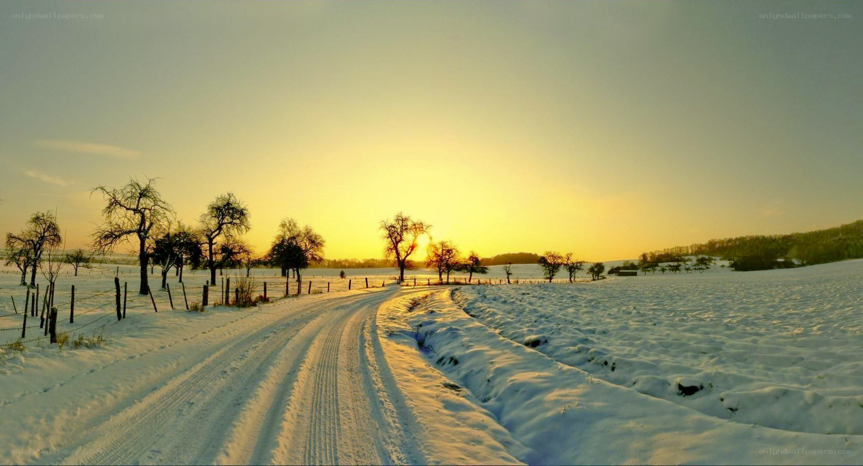 Snowy Road at Sunset
