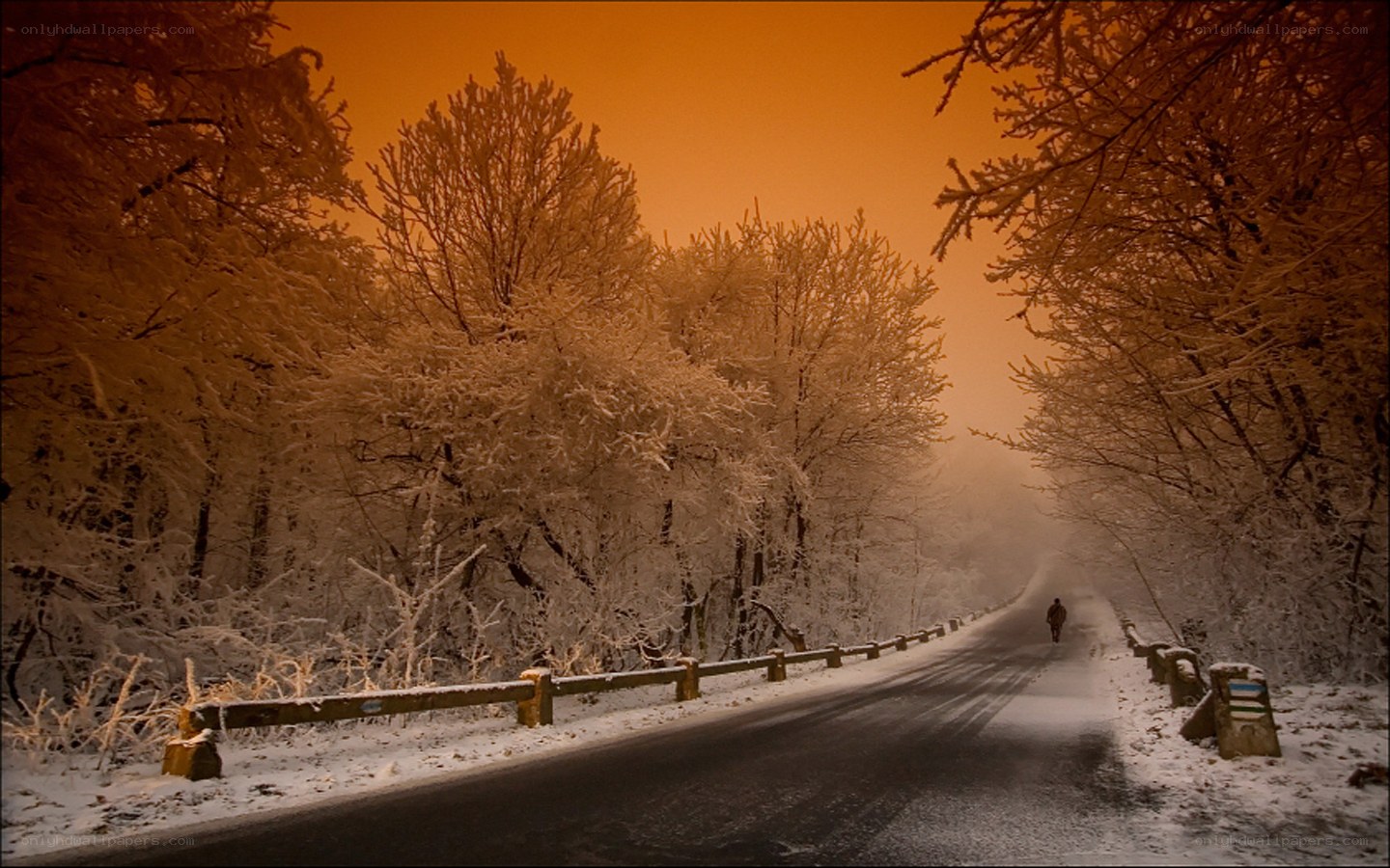 Snowy road at sunset