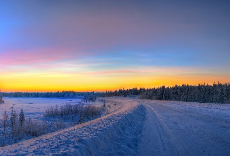 Snowy road at sunset