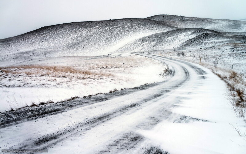 Snowy road in a hilly landscape