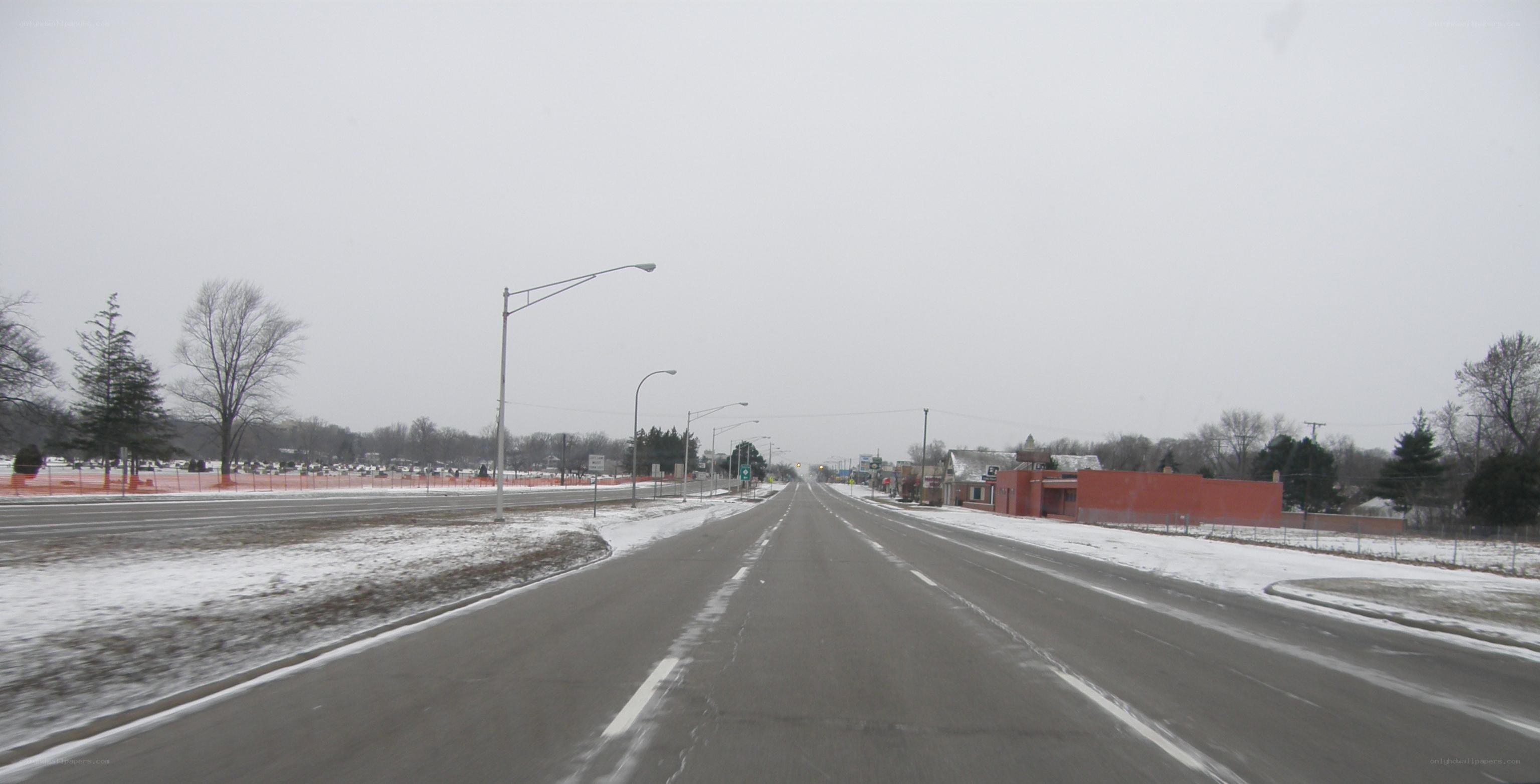 snowy road in a small town
