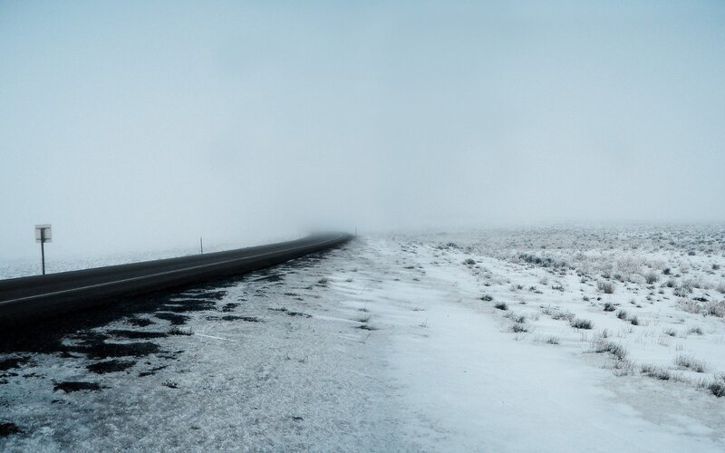 Snowy road in fog