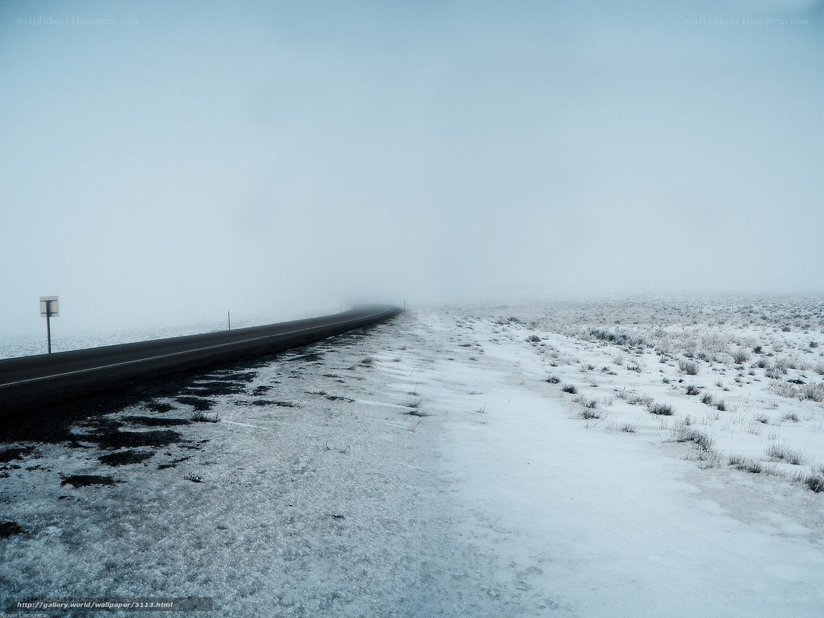 Snowy road in fog