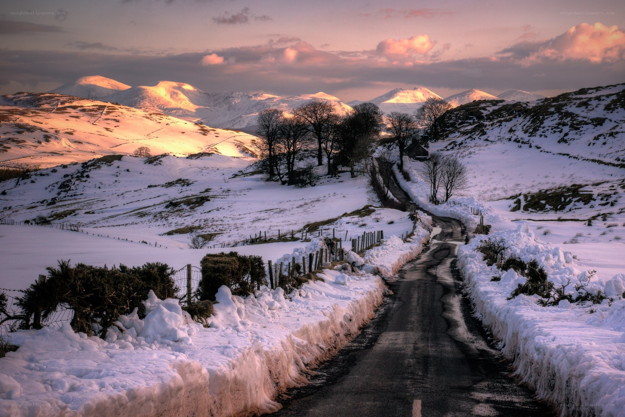Snowy road in mountain landscape