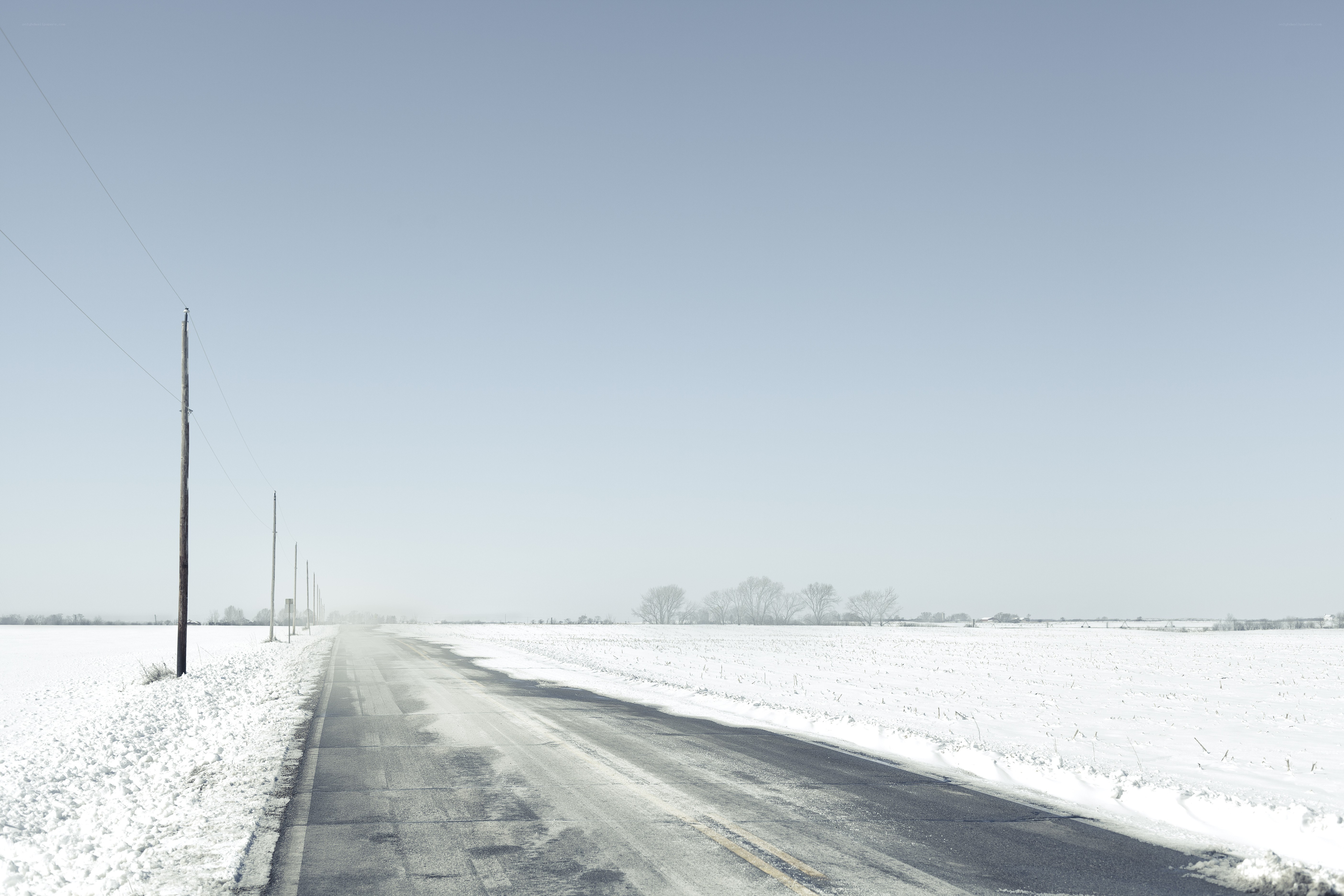 Snowy road in winter landscape