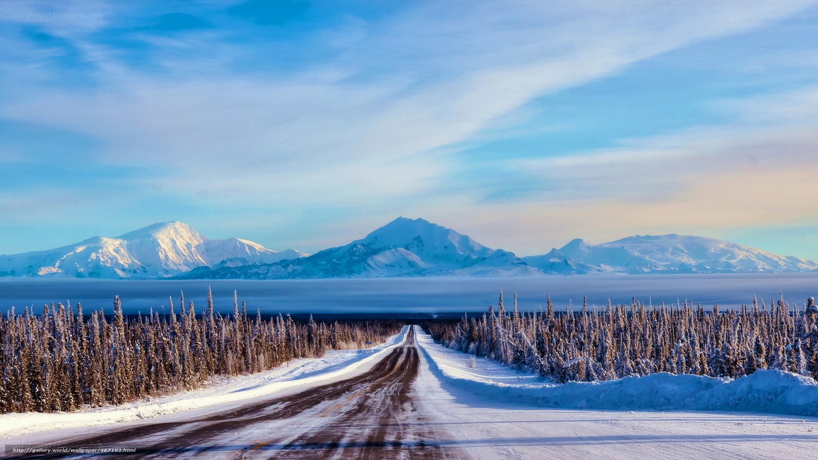 Snowy road to mountains