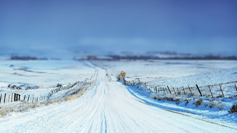 Snowy road with dead end sign