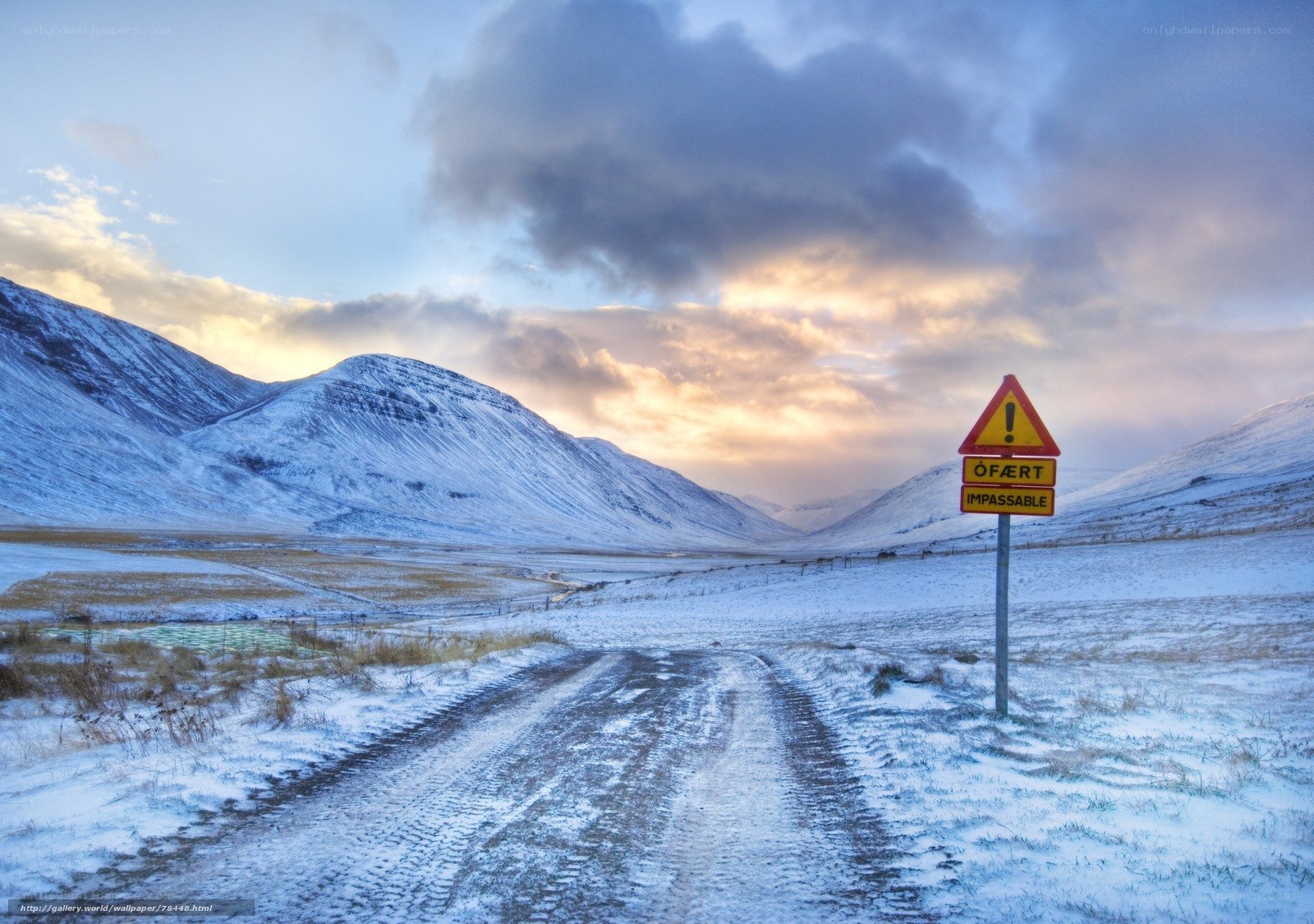 Snowy road with warning sign