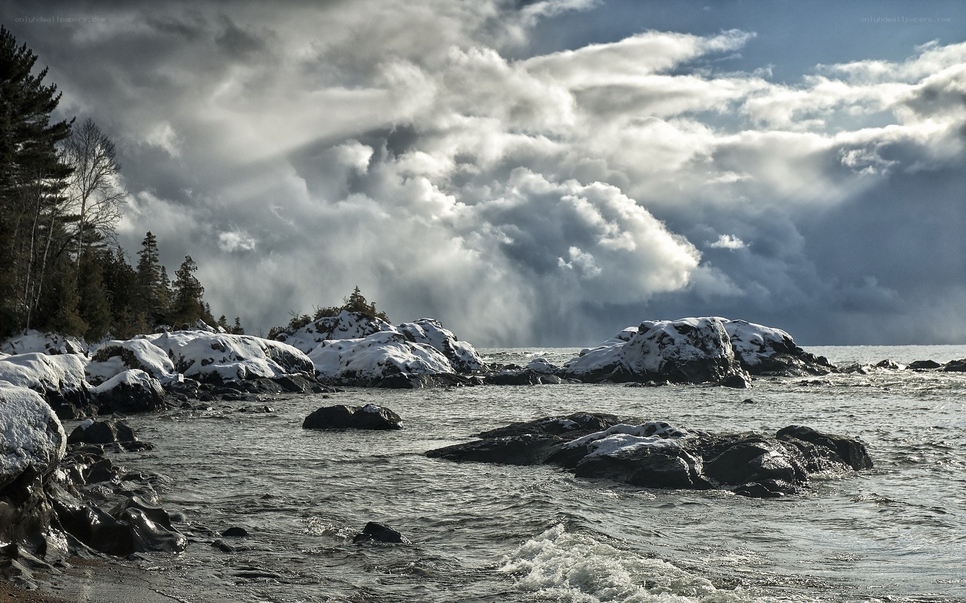 Snowy rocks by the lake