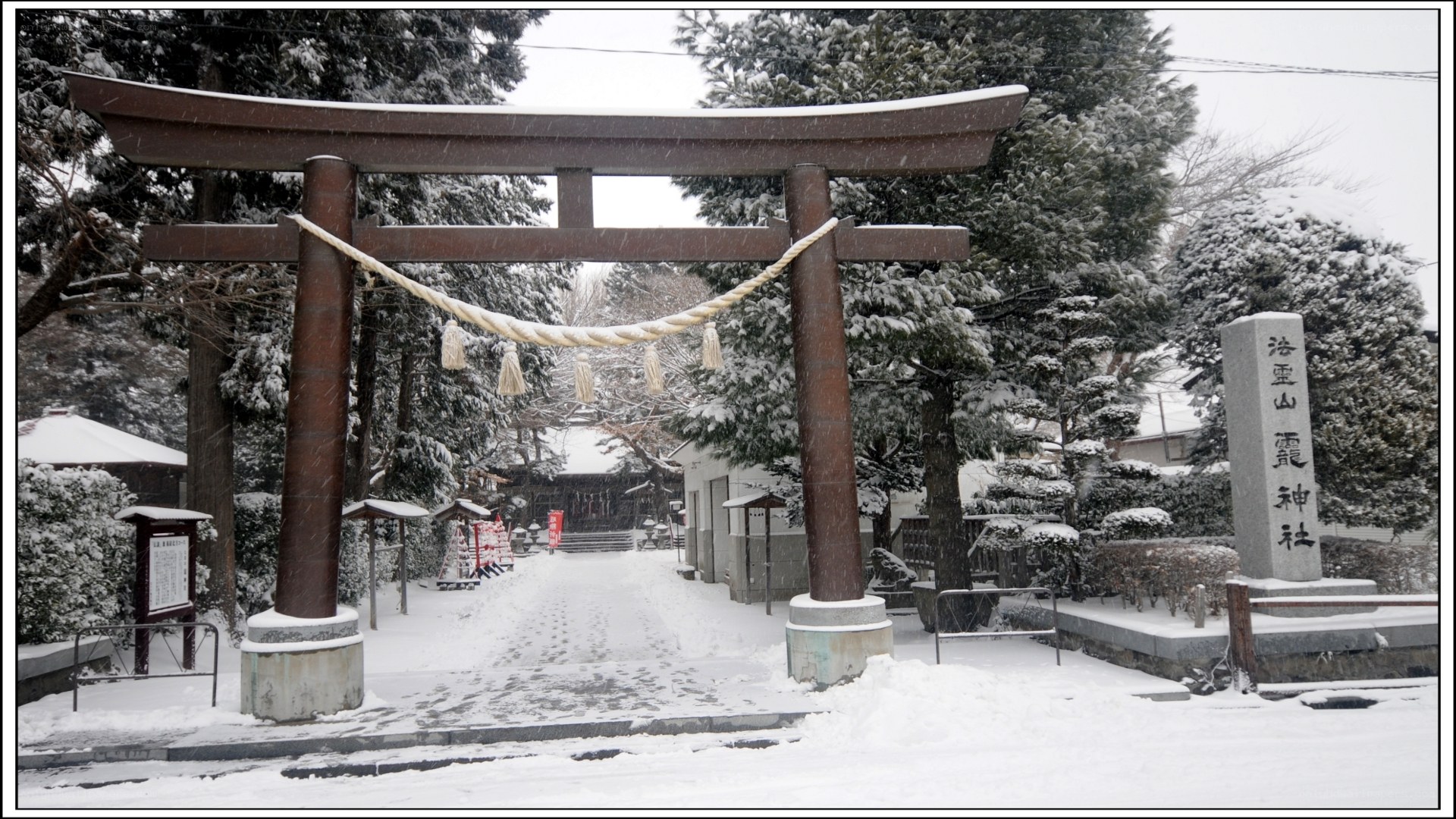 Snowy shrine gate in winter