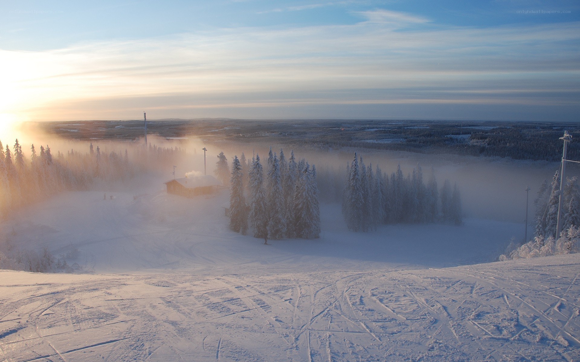 Snowy ski resort at sunrise
