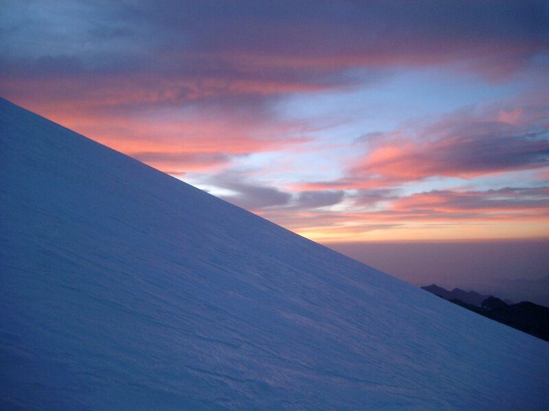 Snowy slope at sunset
