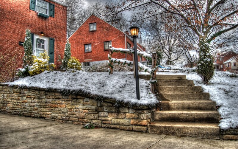 Snowy steps in a residential neighborhood
