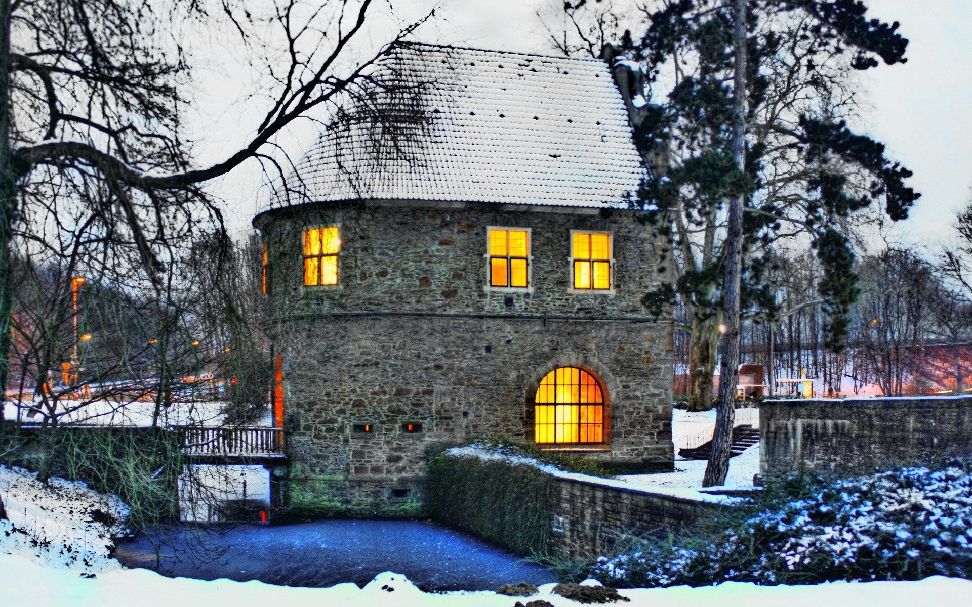 Snowy stone building at dusk