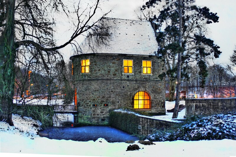 Snowy stone tower at dusk