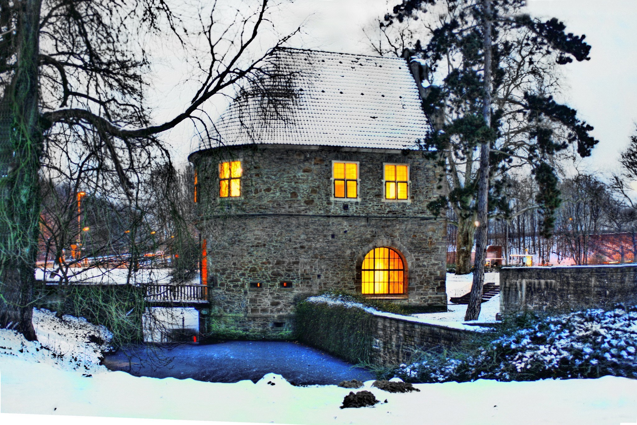 Snowy stone tower at dusk