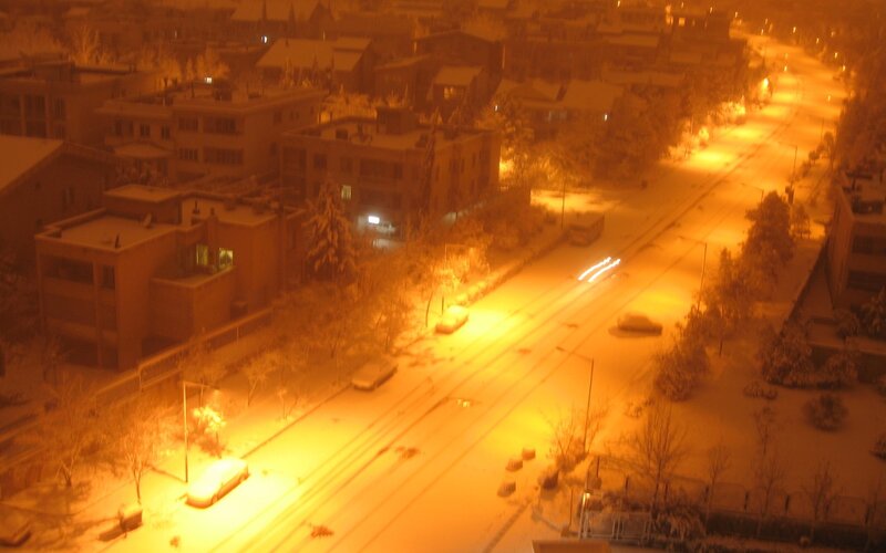 Snowy street at night