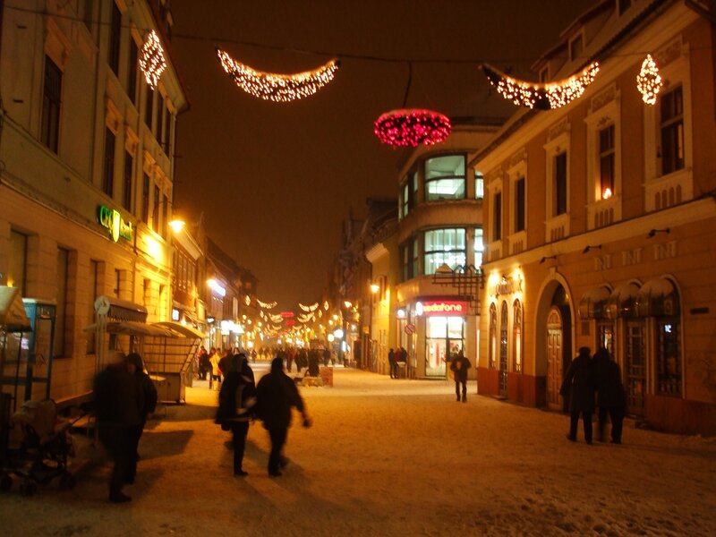 Snowy street at night with lights