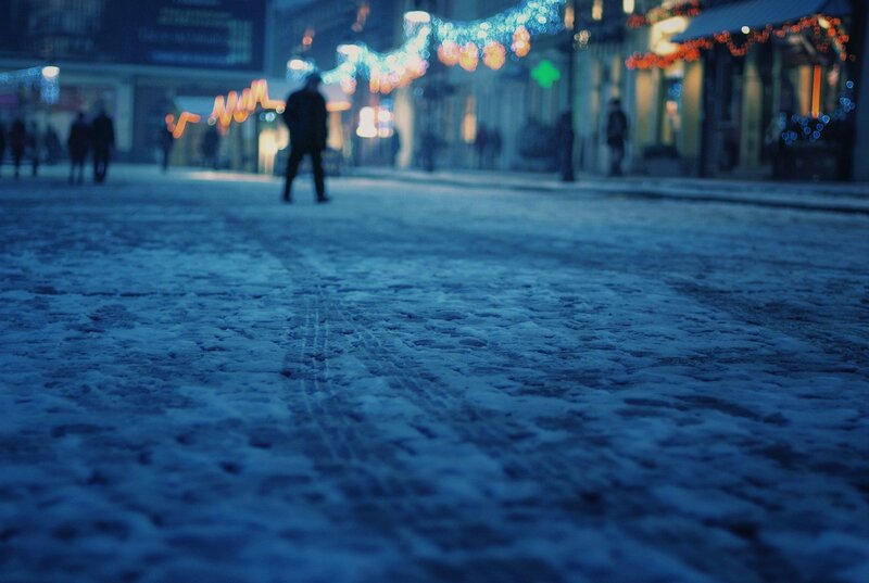 Snowy street at night with lights