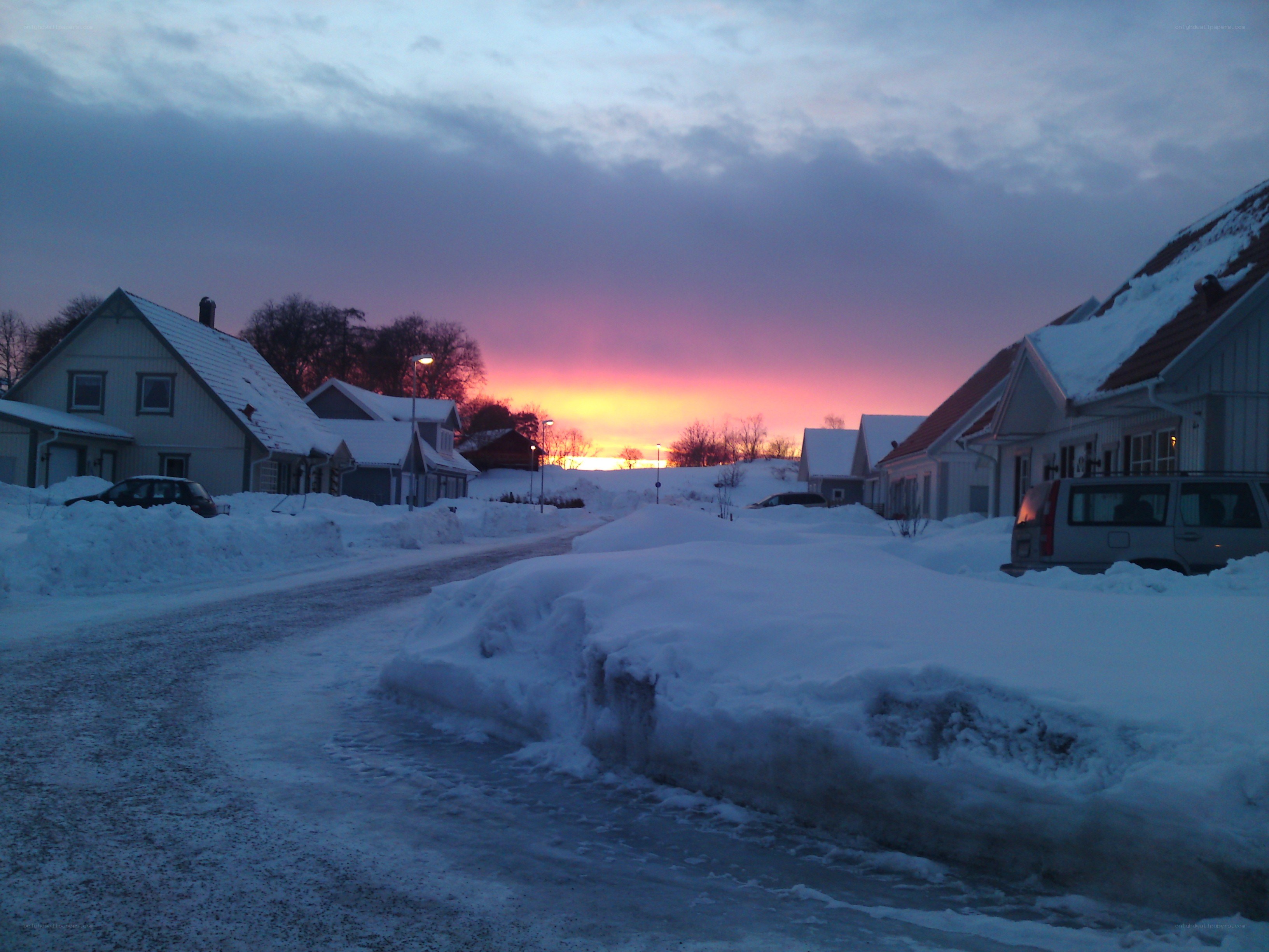 Snowy street at sunset