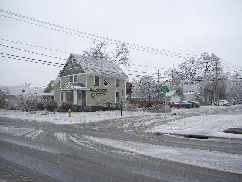 snowy street corner with clinic