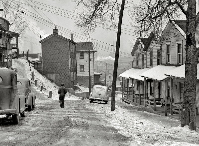 Snowy street in industrial town