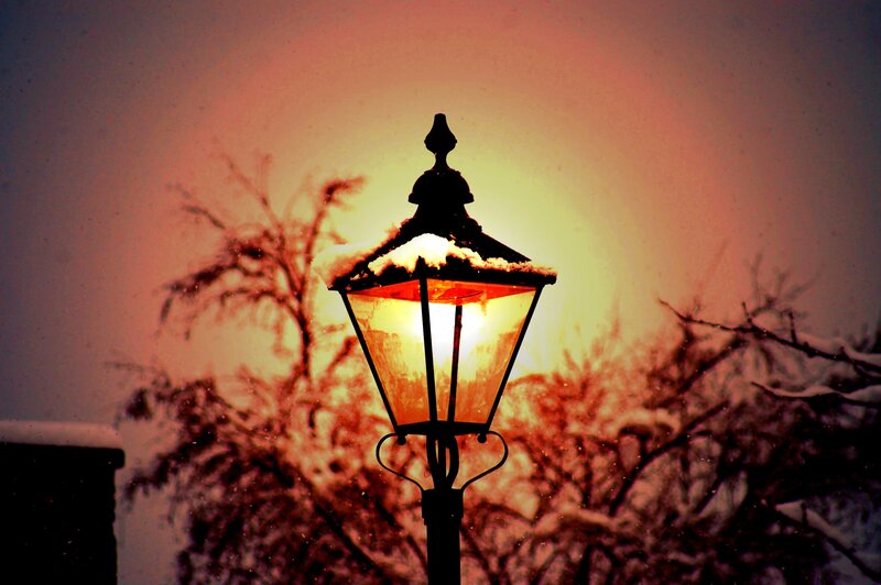 snowy street lamp at dusk