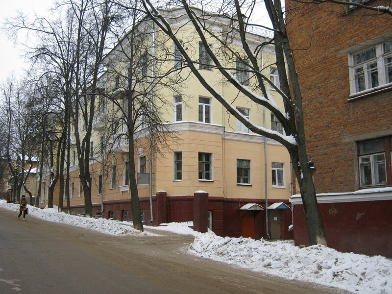 snowy street with buildings