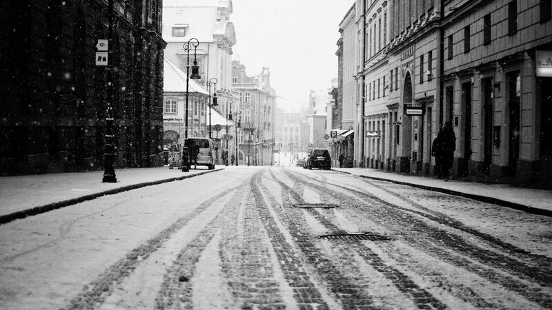 Snowy Street with Car Tracks