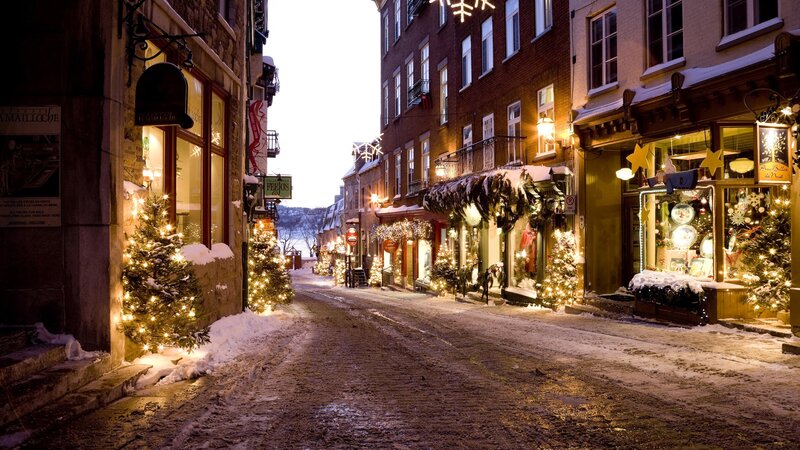 snowy street with Christmas lights