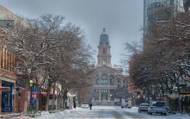Snowy Street with Clock Tower