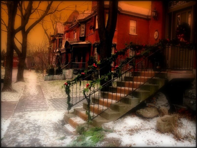 Snowy street with decorated houses
