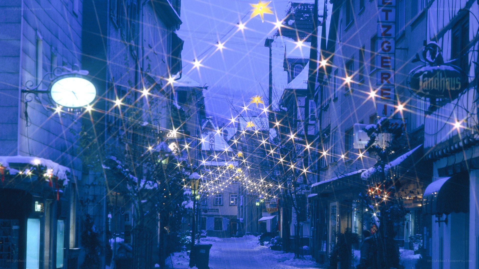 Snowy street with festive lights