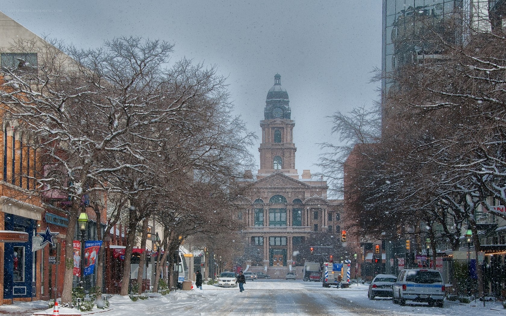 Snowy street with historic building