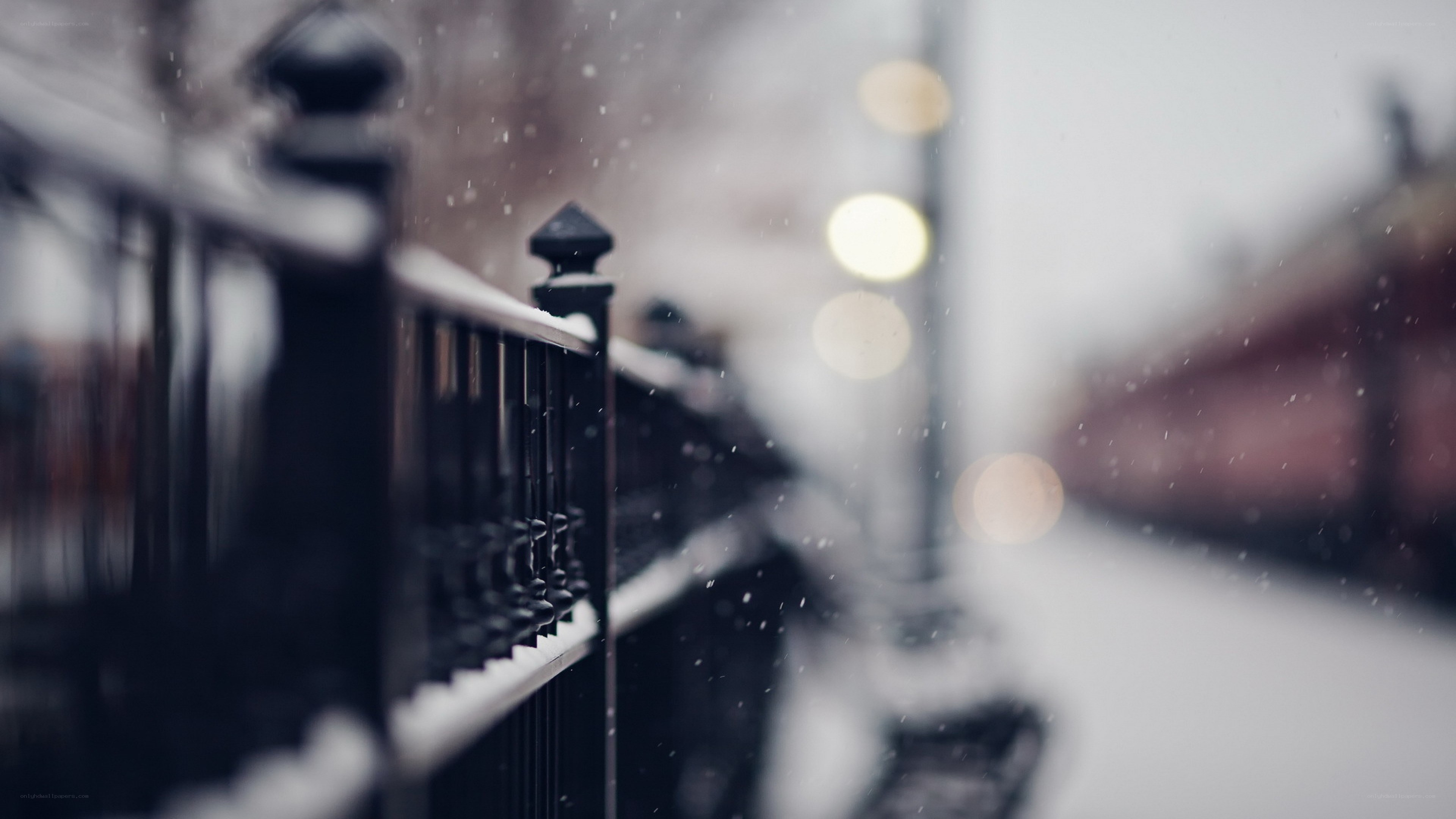 snowy street with railing