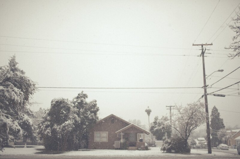 Snowy suburban house scene