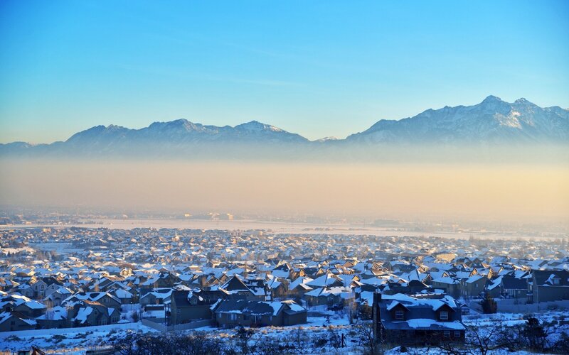 Snowy suburban town with mountains