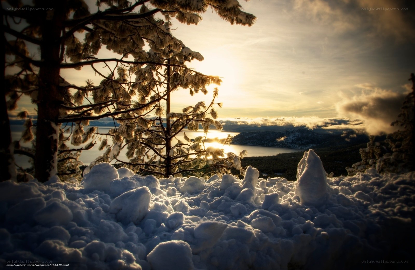 Snowy sunset over a lake