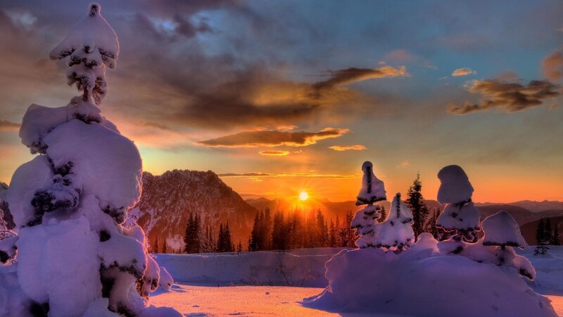 Snowy sunset over mountains