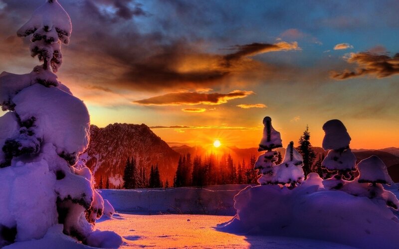 Snowy sunset over mountains
