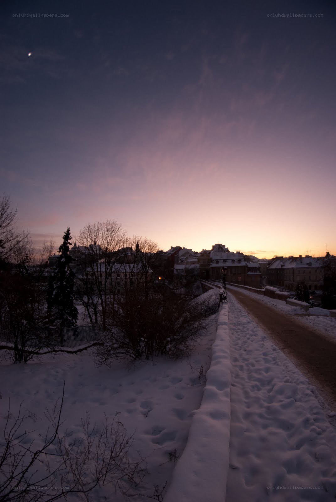 Snowy town at dusk