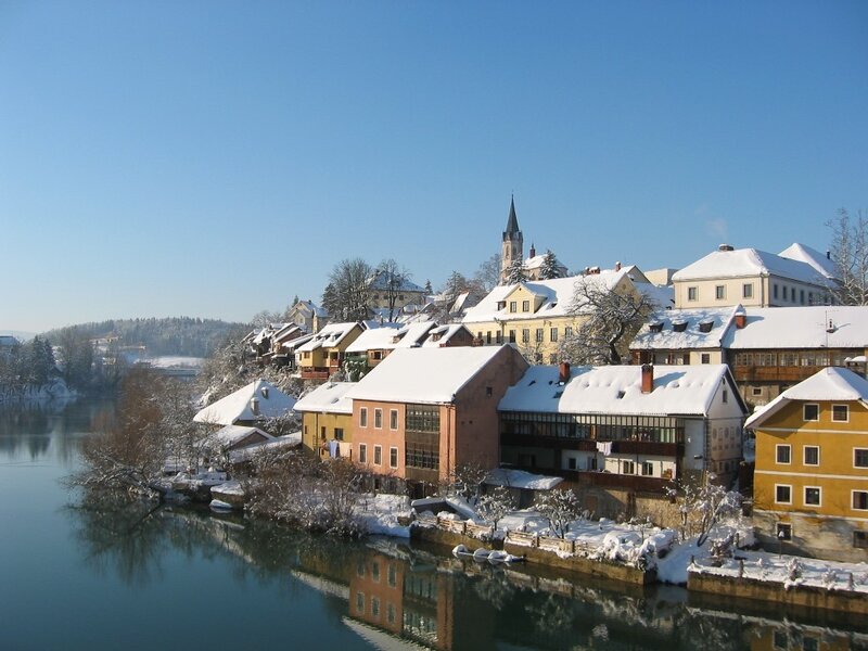 Snowy town by the river