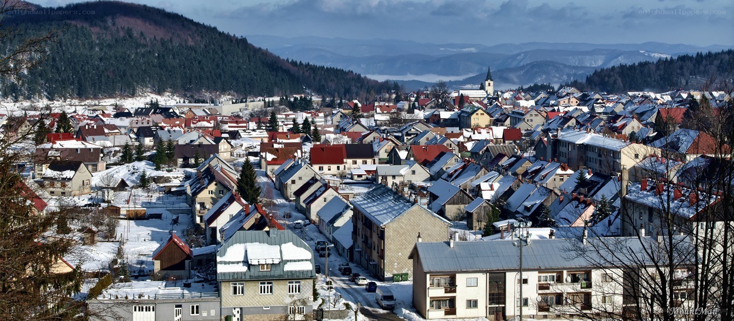 Snowy town in mountain valley