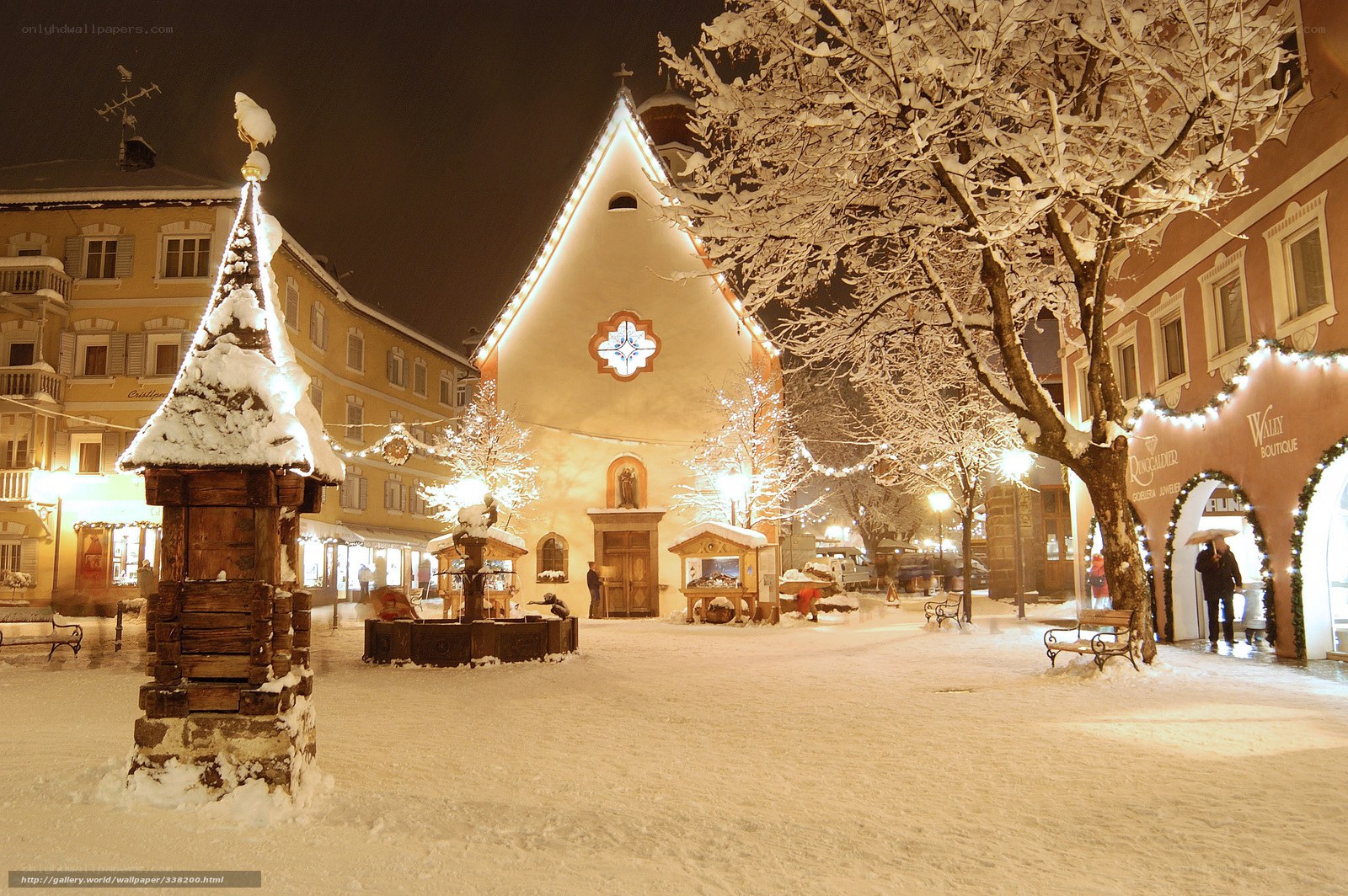 Snowy town square at night
