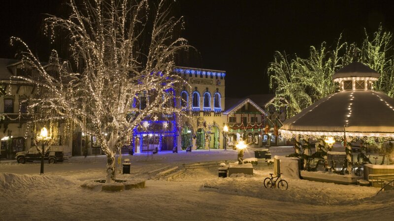 Snowy town square at night